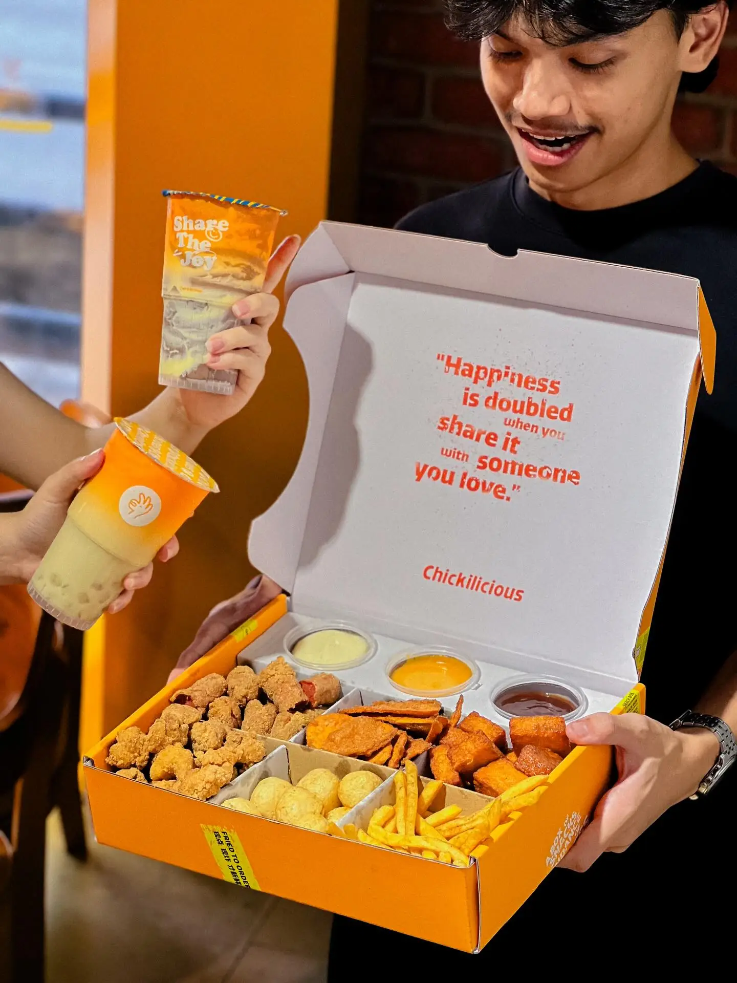 Chickilicious Carousel food and beverage ad: Lifestyle ad for sharing a snack box with someone you love, frame 1 of 5
