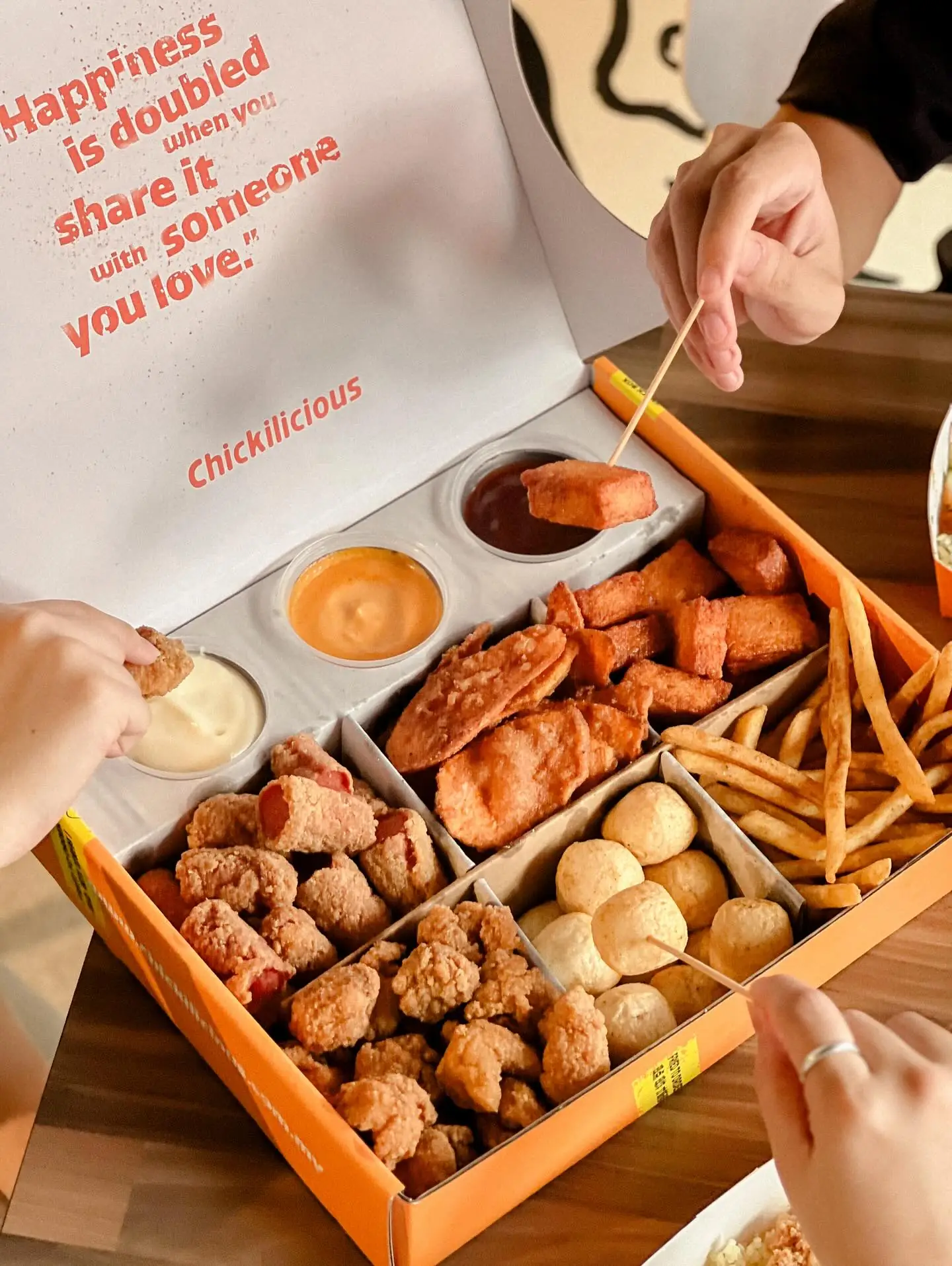 Chickilicious Carousel food and beverage ad: Lifestyle ad for sharing a snack box with someone you love, frame 2 of 5