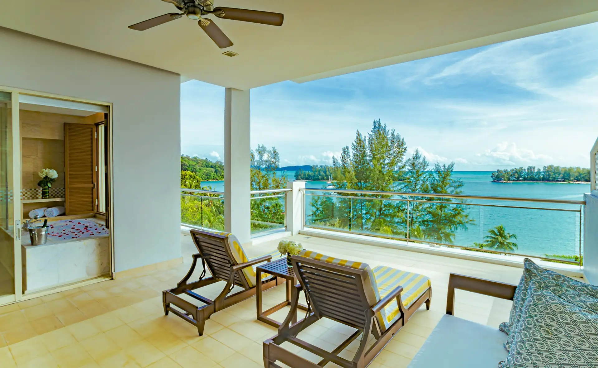 The Danna Langkawi Resort & Beach Villas Dynamic travel and tourism ad: Showcase ad for a sea-view balcony and loungers at The Danna Langkawi