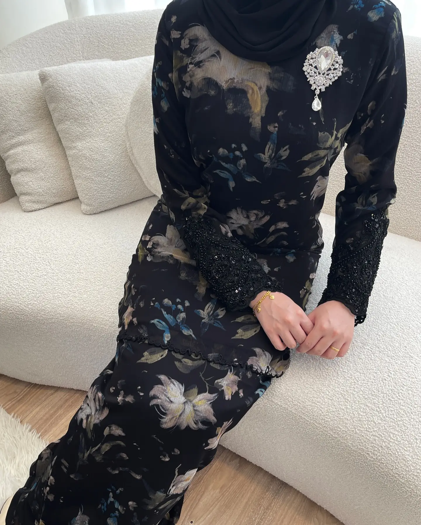 Nadine Couture Carousel fashion ad: Showcase ad for a black floral festive modest dress with beaded lace cuffs, frame 2 of 4