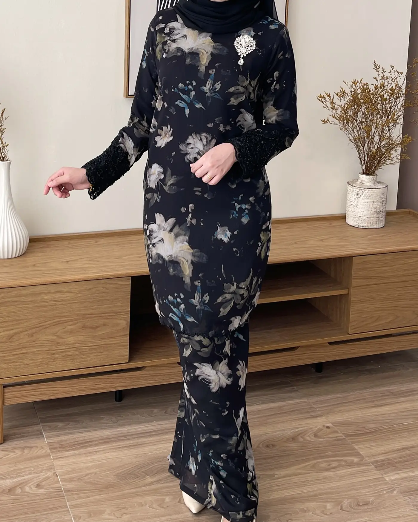 Nadine Couture Carousel fashion ad: Showcase ad for a black floral festive modest dress with beaded lace cuffs, frame 3 of 4