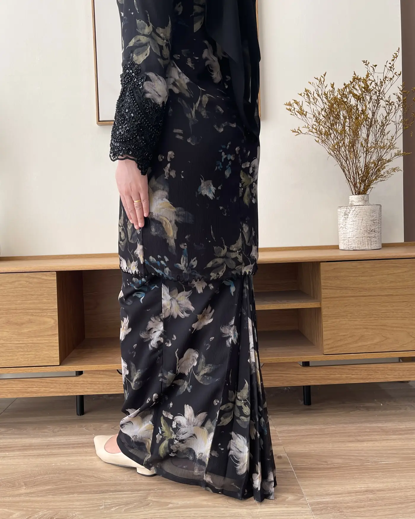 Nadine Couture Carousel fashion ad: Showcase ad for a black floral festive modest dress with beaded lace cuffs, frame 4 of 4