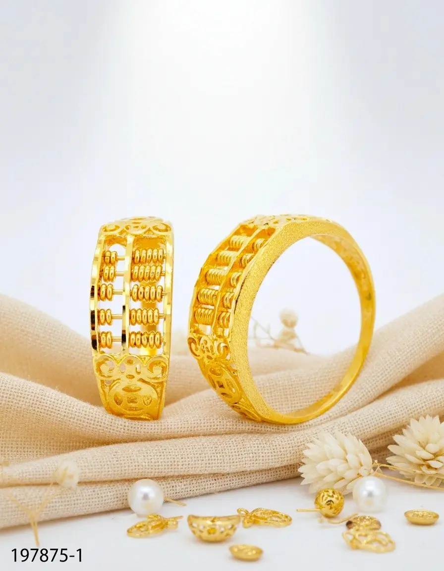 多得金庄 Carousel jewellery and watches ad: Showcase ad for gold abacus rings as a prosperity statement, frame 1 of 2